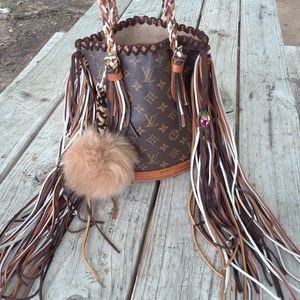 Fringed Louis Vuitton petite bucket PM